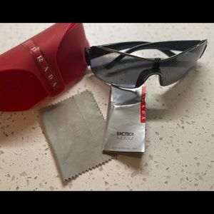 Authentic PRADA Sunglasses Sps 50E 2BR-5Y1 125 With Case and cloth.